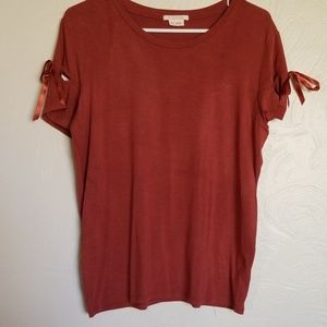 Rust colored short sleeved tshirt with cut outs